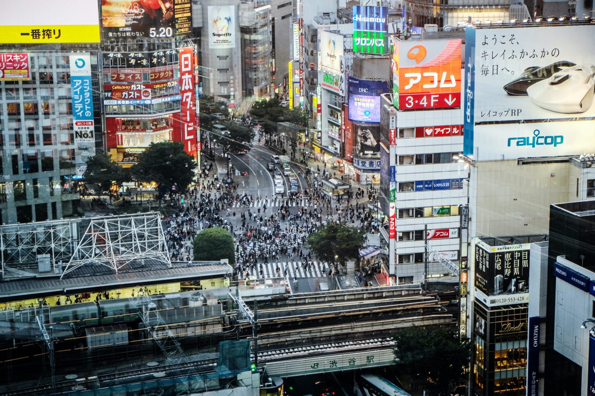 buildings with people in shibuya crossing