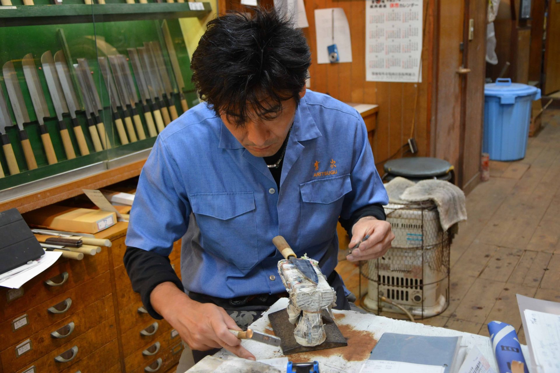 japanese craftsman making knife