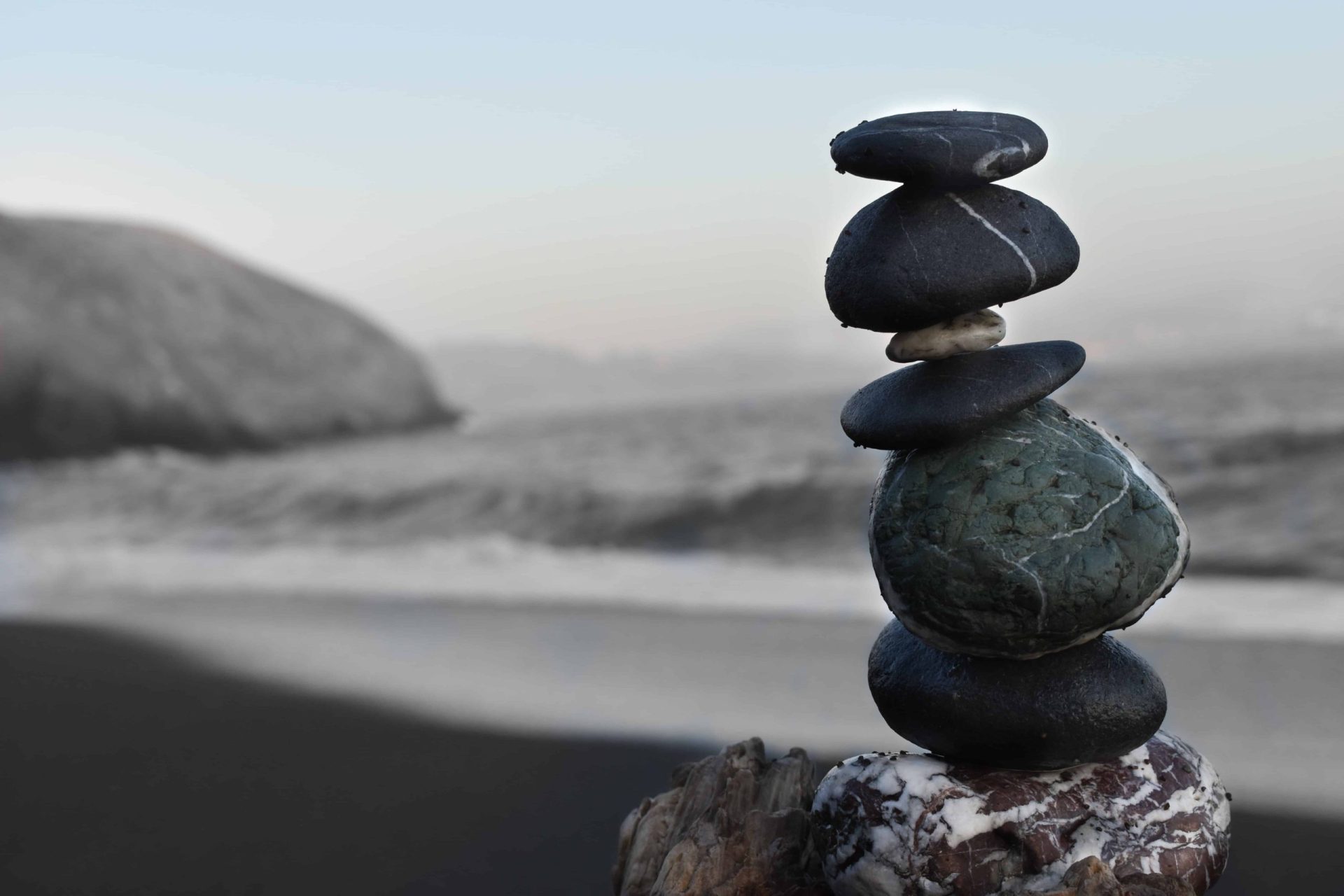 stack of balanced stones in the sea shore