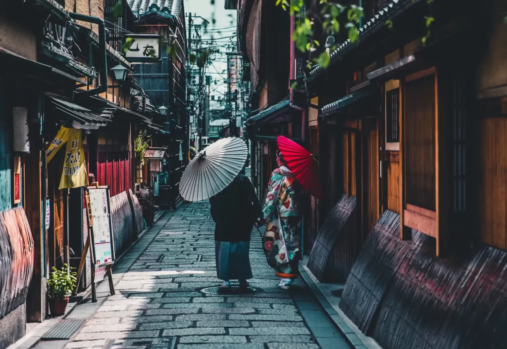 person-walking-on-street-while-holding-umbrella